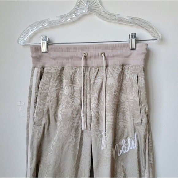 NIKE NSW Jacquard Satin Cuffed Track Pants Cream All Over Print Size XS - Picture 6 of 11